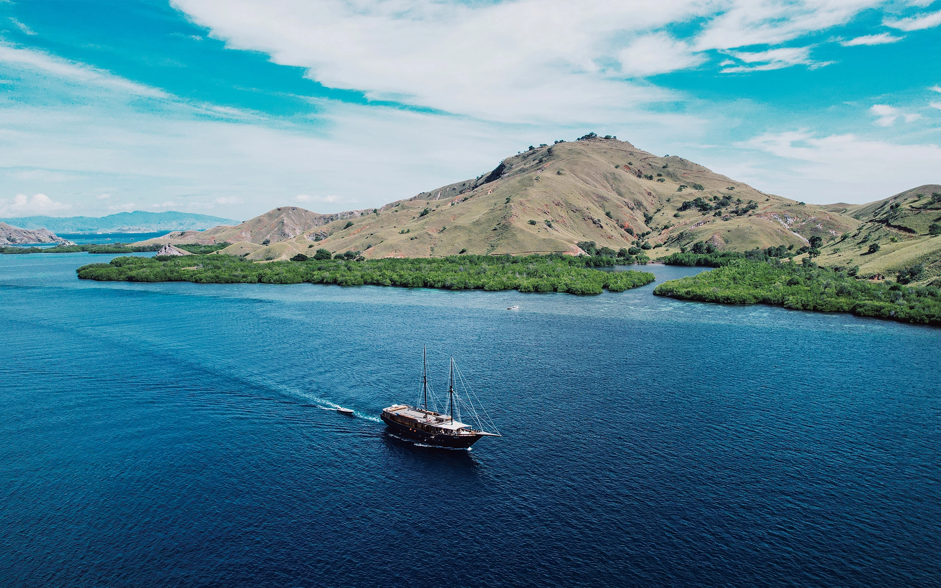 Sunset view of Komodo Liveaboard boat anchored in Komodo National Park.